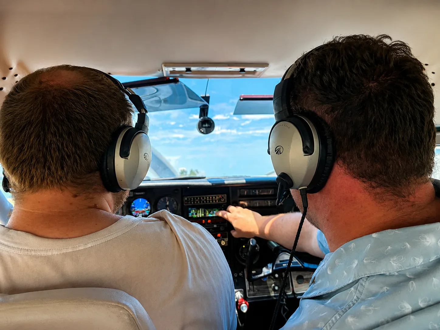 An instructor and pilot flying together in a general aviation aircraft